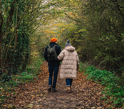 couple going for an autumn walk in the woods